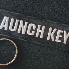 Avation, missile launch tab, keyring.