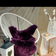 warm and cosy purple sheepskin rug