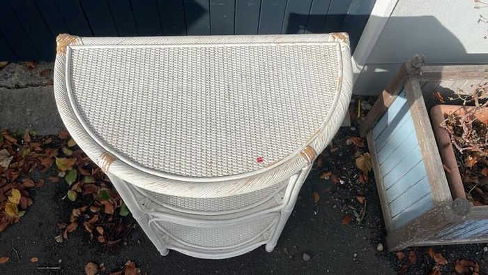 White wicker shelving unit