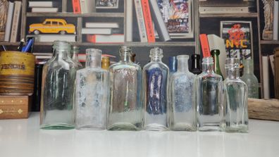 193 - Set of 7 Vintage Clear Glass Collectible Decorative Bottles