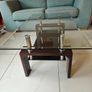 Glass coffee table with dark wood base Image 4