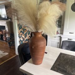 Terracotta vase with artificial grass