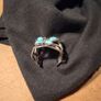 silver tone butterfly cuff bracelet featuring faux turquoise stones and intricate wire work. Image 3