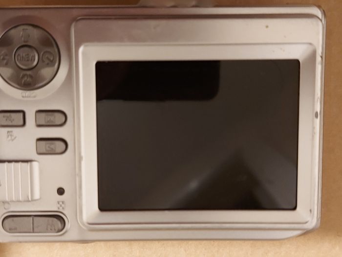 Z880 Digital Camera, Takes 2AA Batteries, working fine, has a modification that doesn't affect its performance