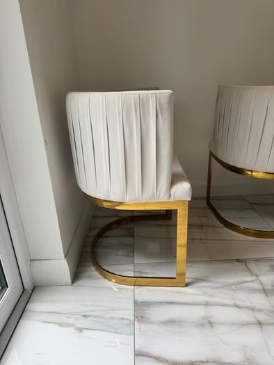 Cream and gold armchairs