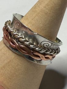 Handmade sterling silver fidget spinner ring with copper.