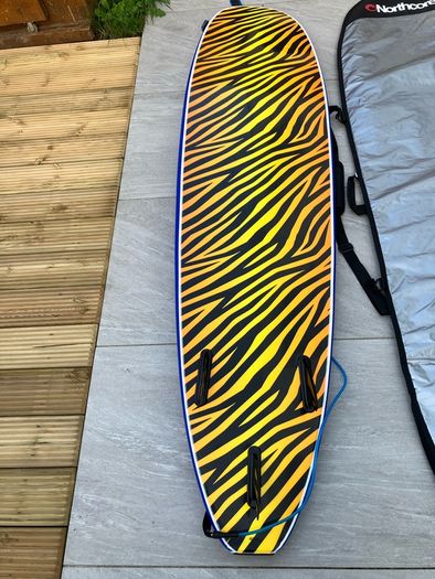 surfboard, bag and leash