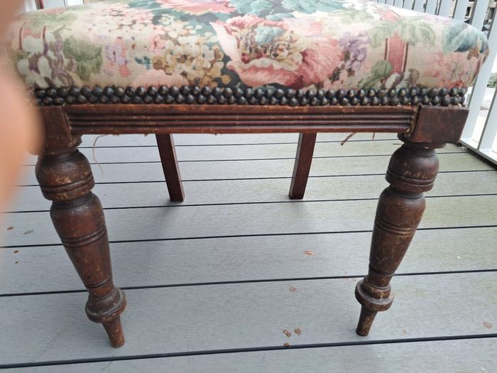 Vintage wooden chair with floral upholstery