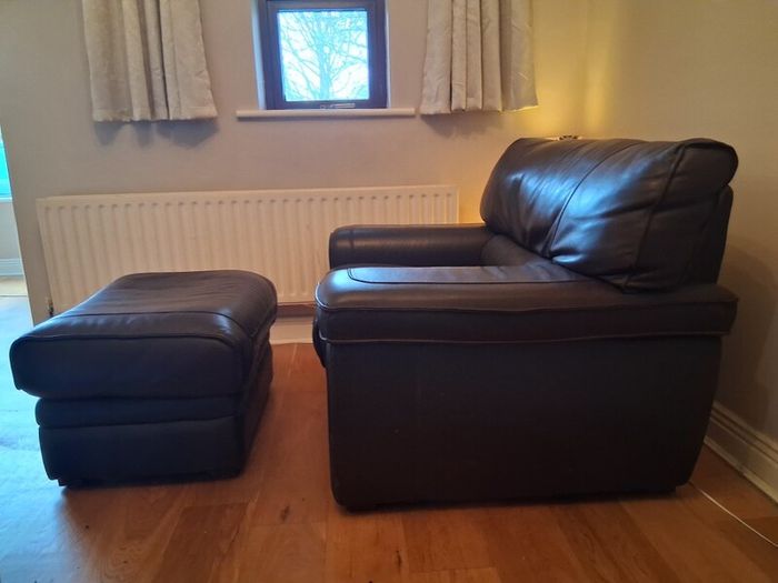 Leather armchair with matching footstool
