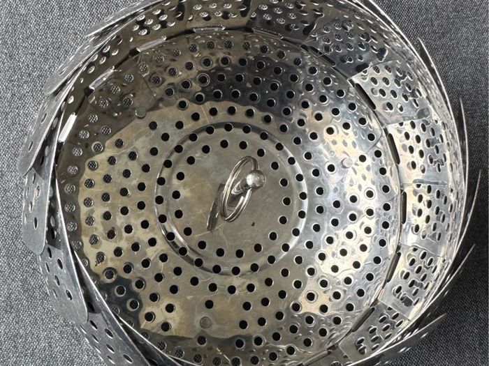 This is a collapsible stainless steel steamer basket
