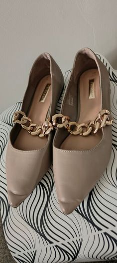 Beige ballet flats with gold chain size 7