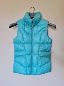 Nike fleece puffer vest Size large girls 26" long turquoise in excellent condition