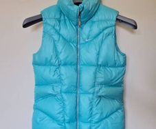 Nike fleece puffer vest Size large girls 26" long turquoise in excellent condition