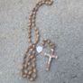 Title: Authentic Jerusalem Olive Wood Rosary & Leather Case  Description: Selling an authentic Catholic rosary made from Holy Land olive wood beads. The back of the crucifix is stamped "JERUSALEM", and the center medal is stamped "TERRA SANTA" with a  Image 5
