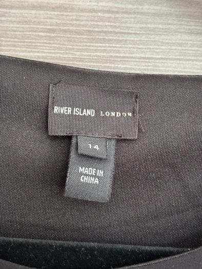 Top with cape-style overlay