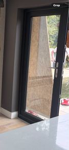 Two anthracite (grey) uPVC doors and one window