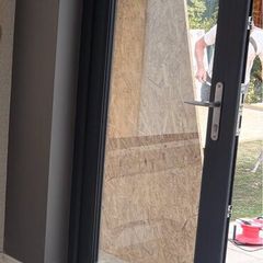 Two anthracite (grey) uPVC doors and one window