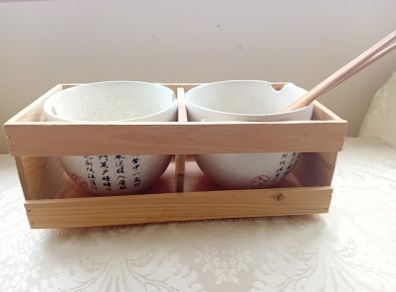 Noodle Bowls Japanese Flower  Set of two noodle bowls boxed in a wooden crate with 2 pairs of chop sticks. These are a great idea for a new home or perhaps the kids setting our on their own. Attractive on the table giving a genuine oriental feel. Weight (