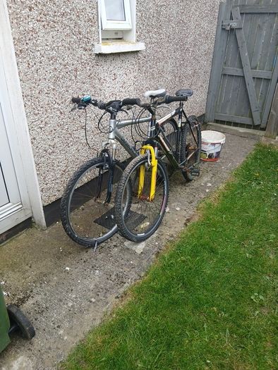 2 bikes silver one medium black one large