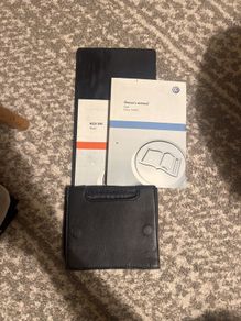 Volkswagen Golf VI owner's manual with leather case