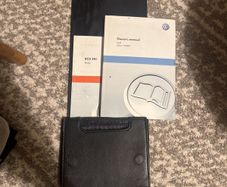 Volkswagen Golf VI owner's manual with leather case
