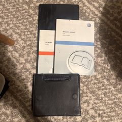 Volkswagen Golf VI owner's manual with leather case