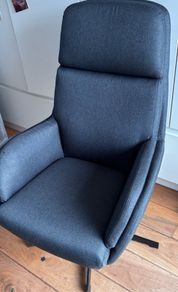 grey swivel chair and footstool