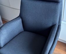 grey swivel chair and footstool