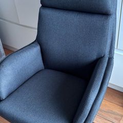 grey swivel chair and footstool