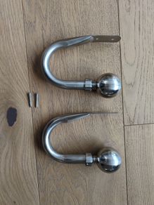 Brushed steel curtain hold backs/tie backs
