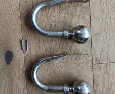 Brushed steel curtain hold backs/tie backs