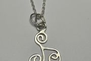 Sterling silver Triskele pendant on 18 or 20 inch chain.