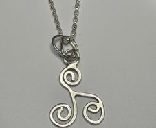 Sterling silver Triskele pendant on 18 or 20 inch chain.