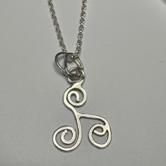 Sterling silver Triskele pendant on 18 or 20 inch chain.