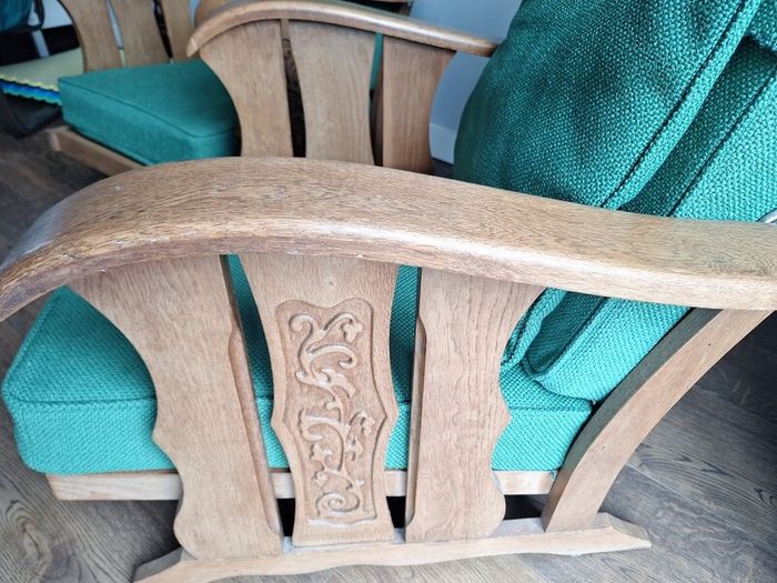 Pair of green arm chairs.