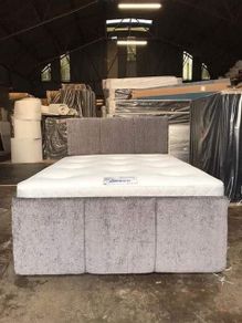 Double grey divan beds with footboards