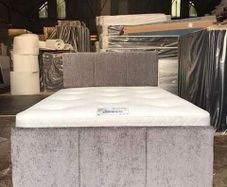 Double grey divan beds with footboards