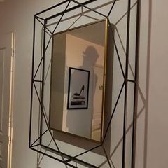 Geometric wall mirror with a metal frame