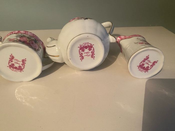 Vintage Porcelain small teapot sugar bowl and creamer set .       porcelain