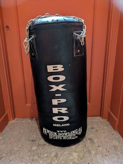 boxing Punch bag and punchbag hanger. Enthusiastically bought by my husband for our, then, 5 yo son. NEVER been punched! recently while playing with friends my son removed the cover.