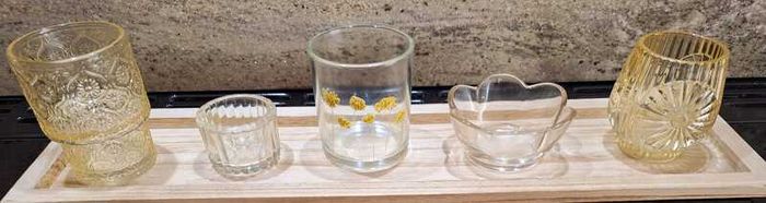 Decorative glasstealight holders on  wooden base