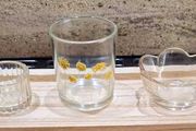 Decorative glasstealight holders on  wooden base