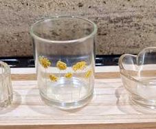 Decorative glasstealight holders on  wooden base