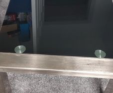 Glass black coffee table with silver legs