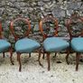 19th century set of four carved walnut balloon back chairs Image 4