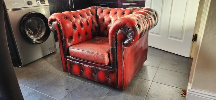 Red leather Chesterfield armchair