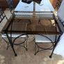 A Luxury Wrought Iron and Smoked Glass Dining Set With 8 Chairs Image 4
