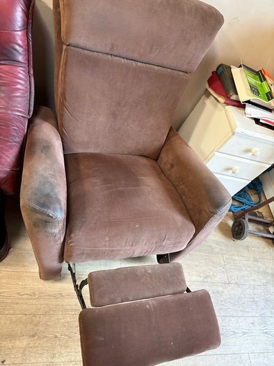 Reclining armchair with footrest