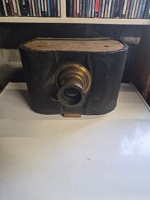 The object in the image is a vintage antique camera