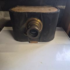The object in the image is a vintage antique camera